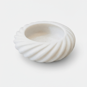 Handcrafted white marble wave bowl by Subyaas, featuring curved rim inspired by water flow – luxury centerpiece and meditation décor.